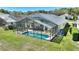 Aerial view of the house showing the backyard and screened-in pool at 916 Balmoral Dr, Davenport, FL 33896