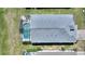 A rooftop view captures a private pool, enclosed for privacy, and surrounded by a well-manicured lawn at 916 Balmoral Dr, Davenport, FL 33896