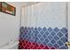 Bathroom featuring an shower with a colorful patterned shower curtain at 916 Balmoral Dr, Davenport, FL 33896