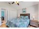 Comfortable bedroom with ceiling fan, wood floor, and a neatly made bed at 916 Balmoral Dr, Davenport, FL 33896