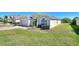 View of a single-Gathering home with manicured lawns and well-maintained landscaping at 916 Balmoral Dr, Davenport, FL 33896