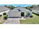 Lovely home with a two-car garage, complemented by beautiful landscaping and a colorful brick driveway at 916 Balmoral Dr, Davenport, FL 33896