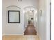 Inviting hallway with arched doorways, leading to various rooms in the home at 916 Balmoral Dr, Davenport, FL 33896