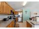 Well-equipped kitchen featuring stainless steel appliances and oak cabinetry at 916 Balmoral Dr, Davenport, FL 33896