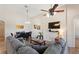 Comfortable living room with a gray sectional, vaulted ceilings, and an adjacent dining area and entertainment center at 916 Balmoral Dr, Davenport, FL 33896