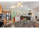 Open concept living space with stainless steel appliances and a large gray couch at 916 Balmoral Dr, Davenport, FL 33896