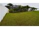 Expansive backyard featuring lush green grass and a privacy fence, perfect for outdoor activities and relaxation at 7726 Ashford Dr, Lakeland, FL 33810