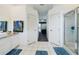 Bright bathroom with a tiled floor, granite countertops and shower with glass door at 7726 Ashford Dr, Lakeland, FL 33810