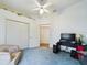 A cozy bedroom featuring ample closet space and neutral carpeting, perfect for comfort at 7726 Ashford Dr, Lakeland, FL 33810