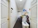 Laundry room with washer, dryer, and water heater at 7726 Ashford Dr, Lakeland, FL 33810