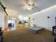 Bright living room with ceiling fan opening up to the kitchen at 7726 Ashford Dr, Lakeland, FL 33810
