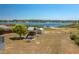 Spacious backyard with a playset and shed, perfect for Gathering fun by the water at 100 Masterpiece Rd, Lake Wales, FL 33898