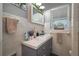 Cozy bathroom featuring a vanity with sink, decorative accents, and a window at 100 Masterpiece Rd, Lake Wales, FL 33898