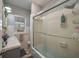 Bathroom with a shower and bathtub combination, a window, and vanity at 100 Masterpiece Rd, Lake Wales, FL 33898