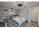 Cozy bedroom featuring a plush rug, comfortable bed, ceiling fan and closet at 100 Masterpiece Rd, Lake Wales, FL 33898