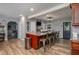 Kitchen island with seating, featuring a large island with dark wood cabinetry at 100 Masterpiece Rd, Lake Wales, FL 33898
