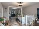 Open concept living room with hardwood floors, modern decor and plenty of space at 100 Masterpiece Rd, Lake Wales, FL 33898