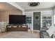 Cozy living room with a television, door with wreath, and comfortable seating at 100 Masterpiece Rd, Lake Wales, FL 33898