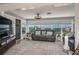 Bright living room featuring large windows, comfortable seating and modern decor at 100 Masterpiece Rd, Lake Wales, FL 33898
