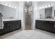 Bathroom featuring double sinks, and a glass enclosed shower at 1057 Sawgrass Dr, Winter Haven, FL 33884