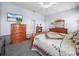 Cozy bedroom featuring wood furnishings and a television on the wall at 1057 Sawgrass Dr, Winter Haven, FL 33884