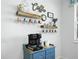 Coffee bar with wooden shelves displaying mugs and decorative items, complete with a Keurig coffee maker at 1057 Sawgrass Dr, Winter Haven, FL 33884