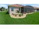 Well-maintained landscaping with flowering plants and bushes bordering the home's exterior, enhancing curb appeal at 1057 Sawgrass Dr, Winter Haven, FL 33884