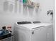 Close up of the modern white washer and dryer at 1057 Sawgrass Dr, Winter Haven, FL 33884