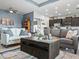Open-concept living area with comfortable sofas, a modern kitchen, and inviting décor at 1057 Sawgrass Dr, Winter Haven, FL 33884