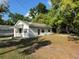 Cozy home nestled among mature trees, offering a serene and private setting at 1109 Neville Ave, Lakeland, FL 33805