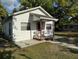 Inviting home with a covered front porch, perfect for enjoying the outdoors at 1109 Neville Ave, Lakeland, FL 33805