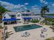 A stunning aerial view of a home with a pool, patio, and lush landscaping, perfect for outdoor living and entertaining at 125 E Graham Park Dr, Haines City, FL 33844