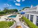Gorgeous backyard with a swimming pool, lush landscaping, and outdoor seating areas for relaxation and entertainment at 125 E Graham Park Dr, Haines City, FL 33844