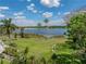 Enjoy the lake view from the spacious, well-manicured backyard at 125 E Graham Park Dr, Haines City, FL 33844