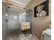 Bathroom with a glass enclosed shower and decorative accents at 125 E Graham Park Dr, Haines City, FL 33844