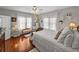 Bright bedroom with hardwood floors, ceiling fan, and natural light at 125 E Graham Park Dr, Haines City, FL 33844