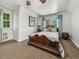 Bedroom with wood floors and ample natural light streaming through the windows at 125 E Graham Park Dr, Haines City, FL 33844