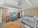 Relaxing bedroom with a cozy bed, television, and ample closet space at 125 E Graham Park Dr, Haines City, FL 33844