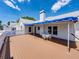 Spacious deck features an outdoor dining area and scenic views of the surrounding neighborhood at 125 E Graham Park Dr, Haines City, FL 33844