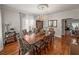 Formal dining room featuring hardwood floors, elegant chandelier, and decorative ceiling medallion at 125 E Graham Park Dr, Haines City, FL 33844