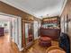 Dressing room with ornate mirror, ottoman, and custom built-ins at 125 E Graham Park Dr, Haines City, FL 33844