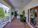 Inviting front porch featuring a decorative wreath, comfortable seating, and scenic views at 125 E Graham Park Dr, Haines City, FL 33844