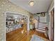 Open-concept living room featuring a fireplace, hardwood floors, and staircase at 125 E Graham Park Dr, Haines City, FL 33844