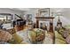 Cozy living room with hardwood floors, a fireplace, and a grand piano at 125 E Graham Park Dr, Haines City, FL 33844