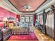 Luxurious main bedroom with hardwood floors and lake views at 125 E Graham Park Dr, Haines City, FL 33844