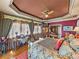 Spacious main bedroom with sitting area, tray ceiling, and lake view at 125 E Graham Park Dr, Haines City, FL 33844