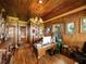 Spacious office with wood paneling, chandelier, and custom built-in desk at 125 E Graham Park Dr, Haines City, FL 33844