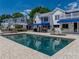 Backyard oasis with a sparkling pool and beautiful landscaping, perfect for relaxation and entertaining at 125 E Graham Park Dr, Haines City, FL 33844
