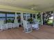Inviting outdoor porch with comfortable seating and scenic views of the water, perfect for relaxation and entertaining at 125 E Graham Park Dr, Haines City, FL 33844