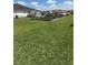 Large backyard featuring a garden and lush green grass, perfect for gardening and outdoor enjoyment at 1403 Hidden Creek Ln, Winter Haven, FL 33880